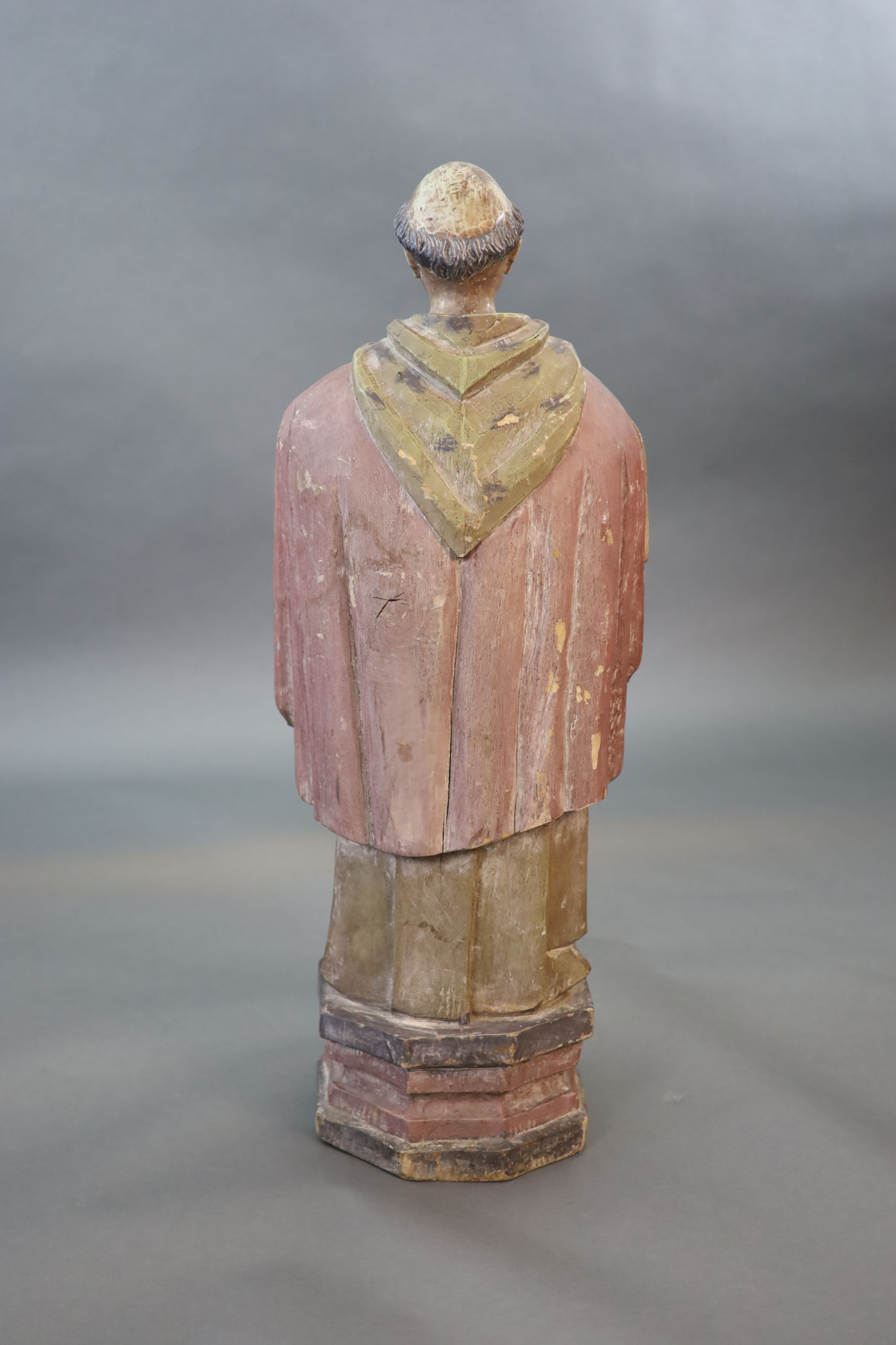 A large carved hardwood study of a standing monk or Saint, early 20th century 102cm high